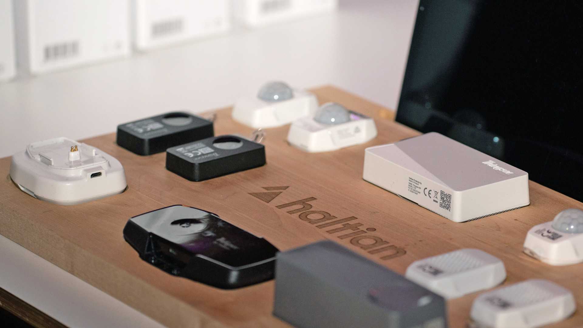Image of table full of Haltian IoT devices that have Wirepas Mesh connectivity in them