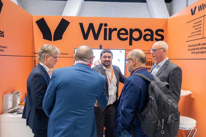 Wirepas employees chatting with event participants at SGT 2026 in Paris